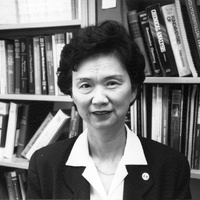 Julia Tai in front of bookshelf (1995)